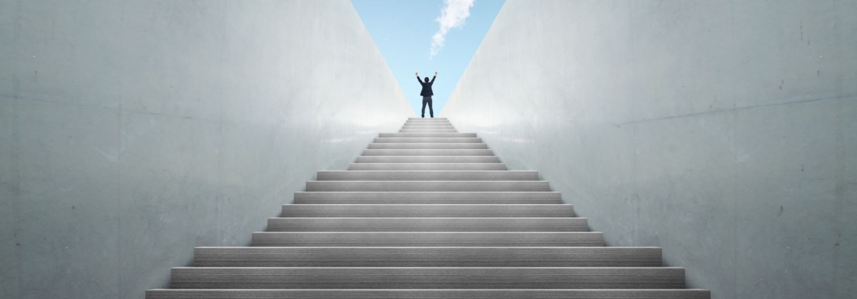 Nonprofit leader climbing stairs representing fundraising treadmill