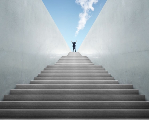 Nonprofit leader climbing stairs representing fundraising treadmill