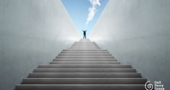 Nonprofit leader climbing stairs representing fundraising treadmill