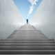 Nonprofit leader climbing stairs representing fundraising treadmill