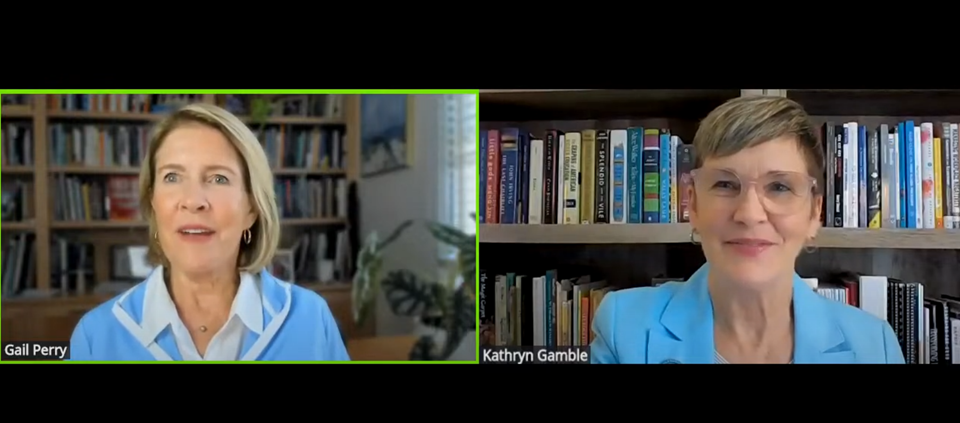 Two women discussing major gift officer skills sitting in front of bookcases.