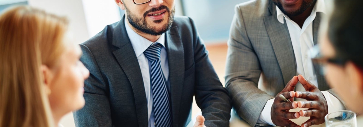 Nonprofit leaders meeting with a fundraising consultant to discuss strategy