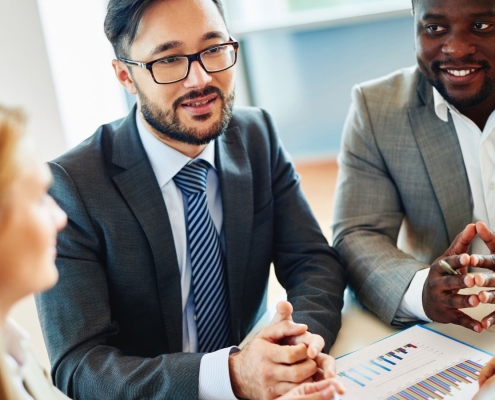 Nonprofit leaders meeting with a fundraising consultant to discuss strategy