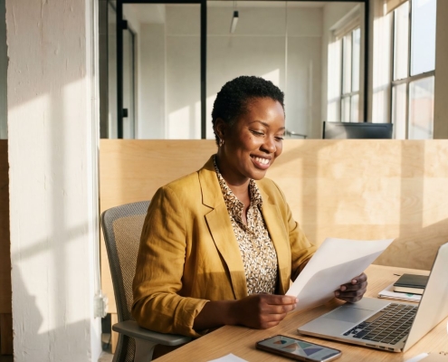 Fundraiser preparing for a major donor cultivation visit, reviewing notes