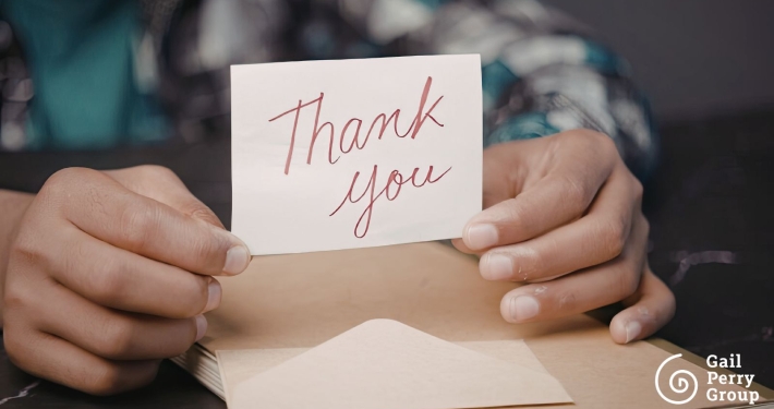 Fundraiser handwriting a personal note to a major donor after receiving a gift