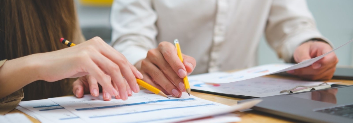 Fundraising consultant reviewing feasibility study interview data with nonprofit leaders