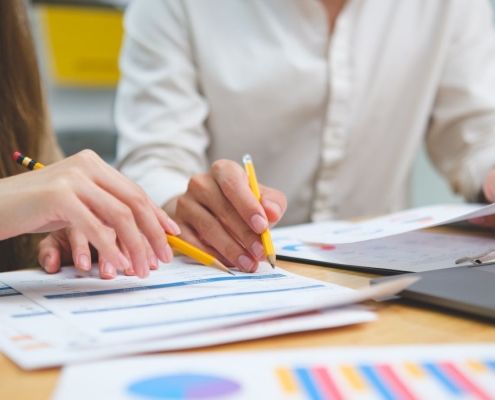 Fundraising consultant reviewing feasibility study interview data with nonprofit leaders