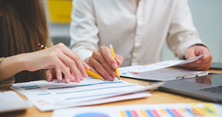 Fundraising consultant reviewing feasibility study interview data with nonprofit leaders