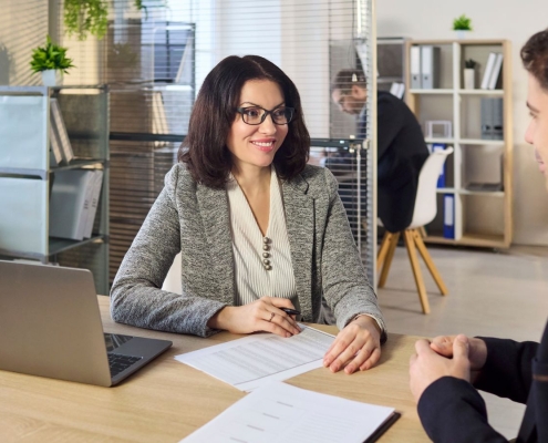Fundraising consultant reviewing feasibility study interview data with nonprofit leaders