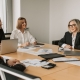 Executive director presenting board fundraising strategy at a nonprofit board meeting