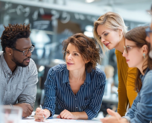 High-performing fundraising team collaborating during a strategy meeting