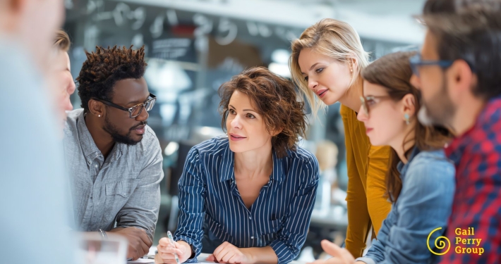 High-performing fundraising team collaborating during a strategy meeting