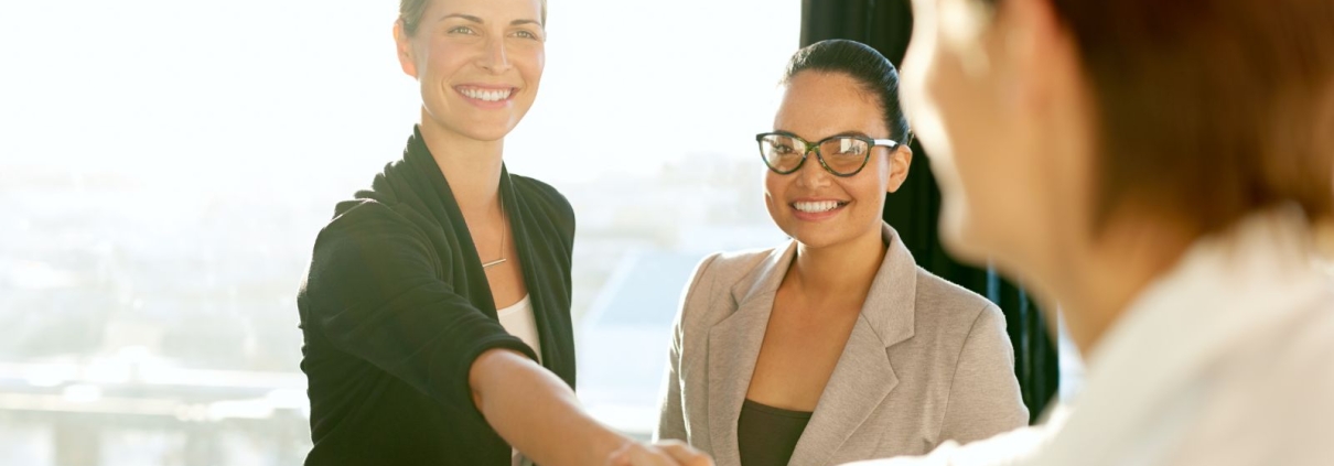 Employer shaking hands with new hire.
