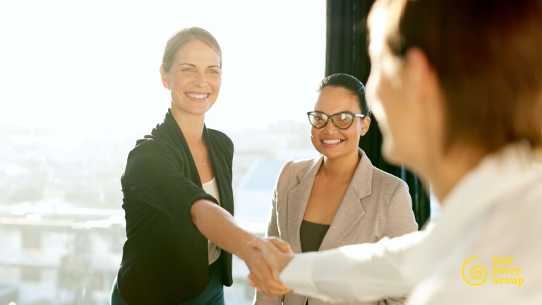 Employer shaking hands with new hire.