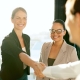 Employer shaking hands with new hire.