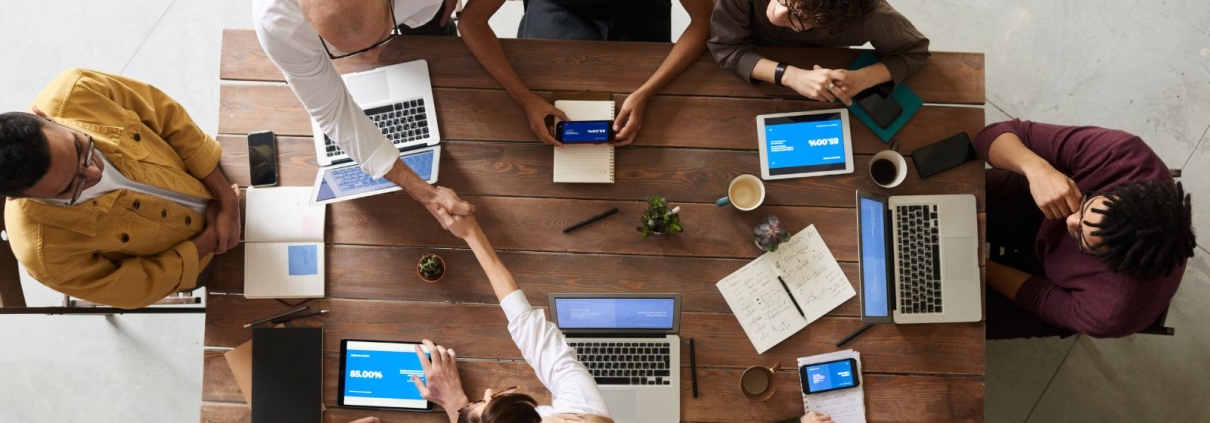 Fundraising team sitting around conference table