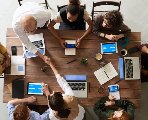 Fundraising team sitting around conference table