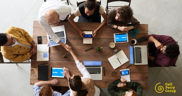 Fundraising team sitting around conference table