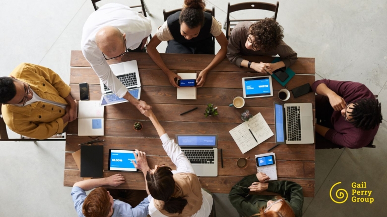 Fundraising team sitting around conference table