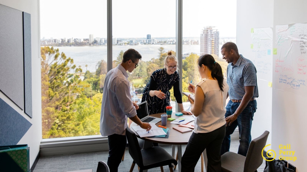 Nonprofit staff sharing donor impact stories during a team meeting