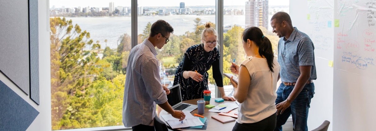 Nonprofit staff sharing donor impact stories during a team meeting