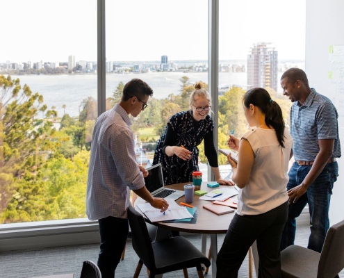 Nonprofit staff sharing donor impact stories during a team meeting