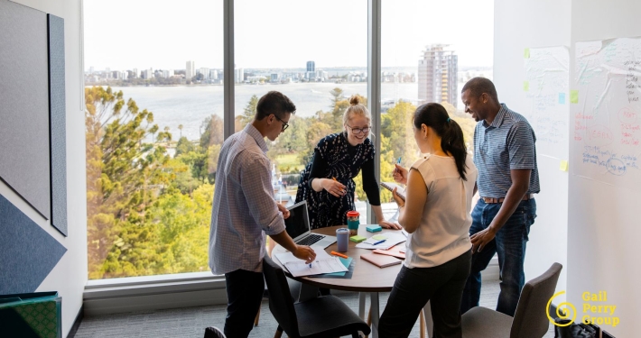 Nonprofit staff sharing donor impact stories during a team meeting