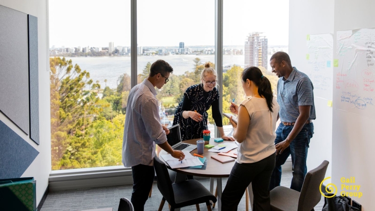 Nonprofit staff sharing donor impact stories during a team meeting